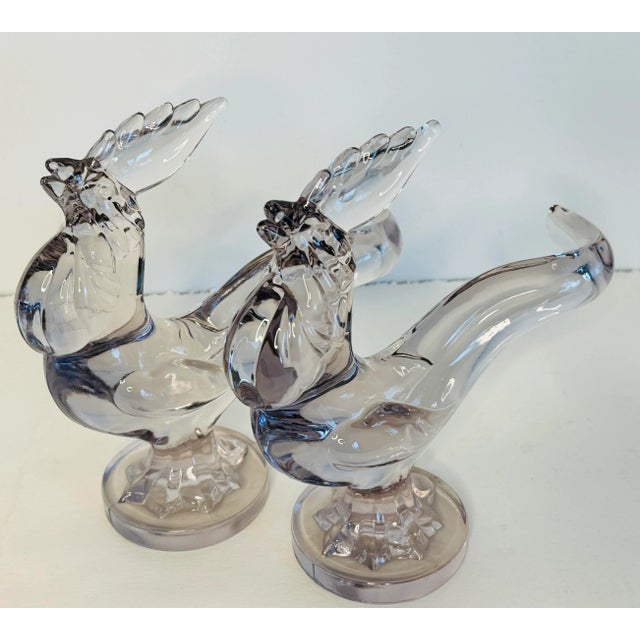 Vintage 1940s pair of tall solid glass rooster figurines by New Martinsville Company. The roosters are hand blown and sit...