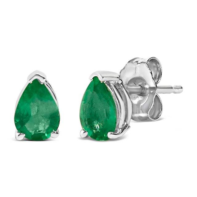 Envision the allure of glimmering emerald isles each time you adorn these exquisite solitaire stud earrings, featuring...