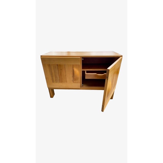 Maison Regain, Sideboard with three doors in elm, 1960s Maison Regain, rare sideboard with two rectangular doors in blond...