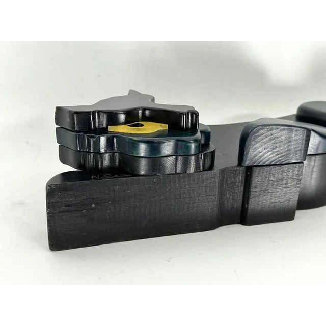 Italian sculpture in wood portraying a black panther. The head can be rotated in different positions. Good vintage...