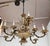 Vintage silver plate and brass twelve arm two-tiered chandelier. Lovely bouquet theme seen throughout, with elegant curved...