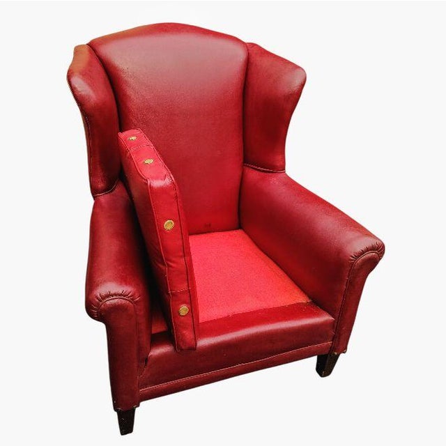 Vintage Red Leather Wingback Chair & Ottoman Indulge in classic American design with this stunning vintage wingback chair...