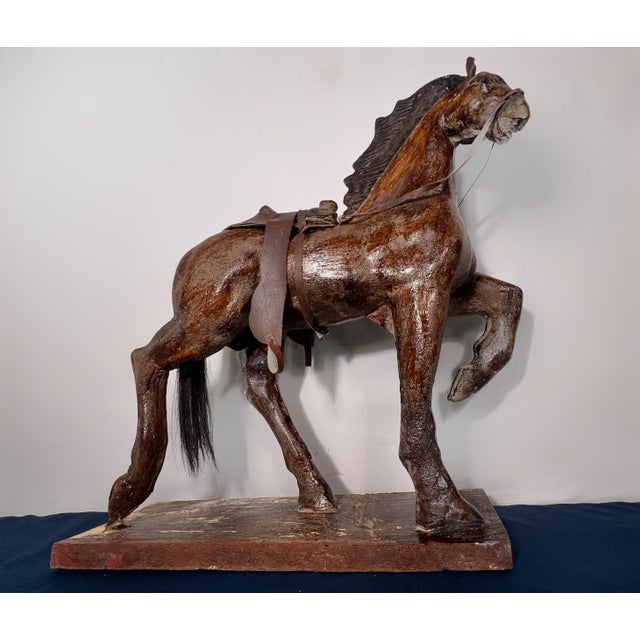 Early 20th century American folk art composition plaster horse mounted on its original painted wood base. Retains its...