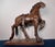 Early 20th century American folk art composition plaster horse mounted on its original painted wood base. Retains its...