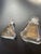 This glass perfume bottle features a distinct geometric, flared trapezoidal design Art Deco glassware, popularized by...