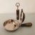 Curious pair: bottle opener and "silent butler" for table waste, crown caps etc. Typical design by Aldo Tura, combining...