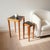 Vintage c.1960s–70s pair of Mid-Century Modern nesting/side tables featuring slender warm-toned wood frames and removable...