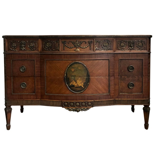 A beautifully crafted early 20th-century Neoclassical sideboard featuring richly figured mahogany veneers, exceptional...