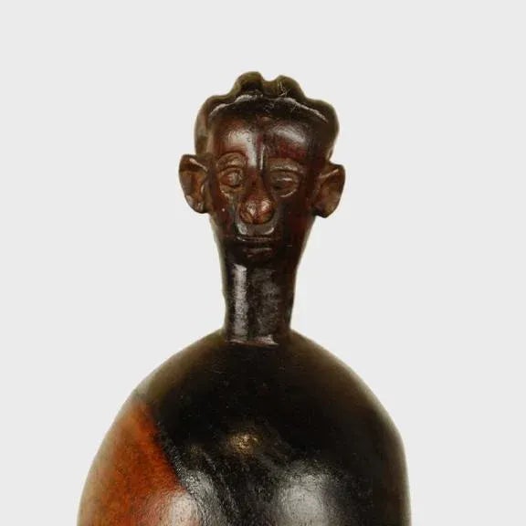 Doted on like an actual child, this carved doll was once owned by a young girl among the Namji people of northwest...