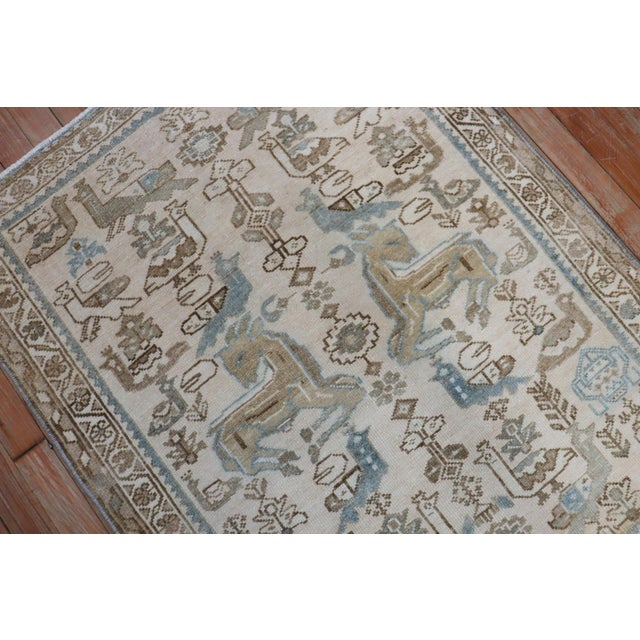 1950s Persian Rug in neutral tones featuring an animal motif
