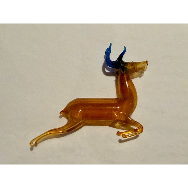 Rare, wonderfully articulated antique German mercury glass reindeer ornament in an unusual color combination of brown with...