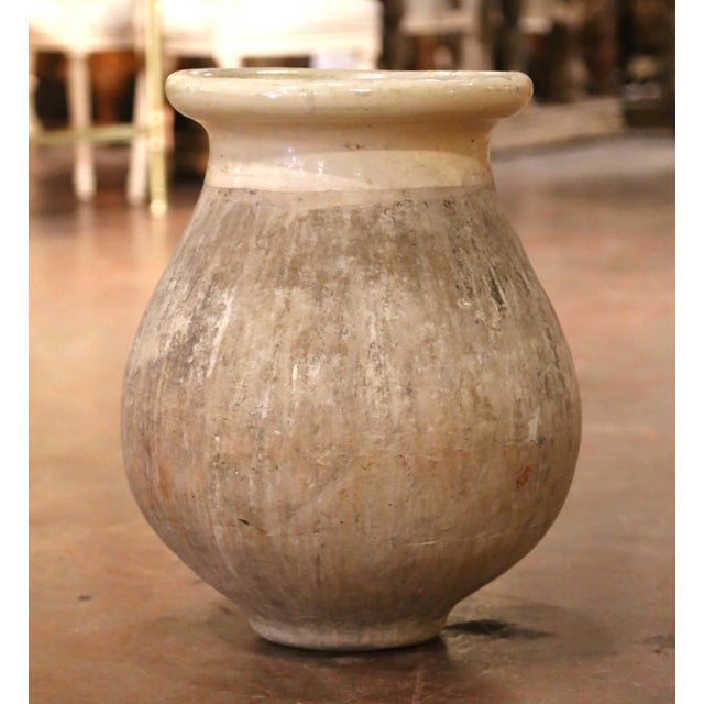 This beautifully weathered antique olive oil jar was crafted in Biot, in the South of France, circa 1860. Hand-thrown from...