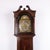English longcase clock crafted in mahogany with marquetry decoration and a brass dial. The clock dates from around the...