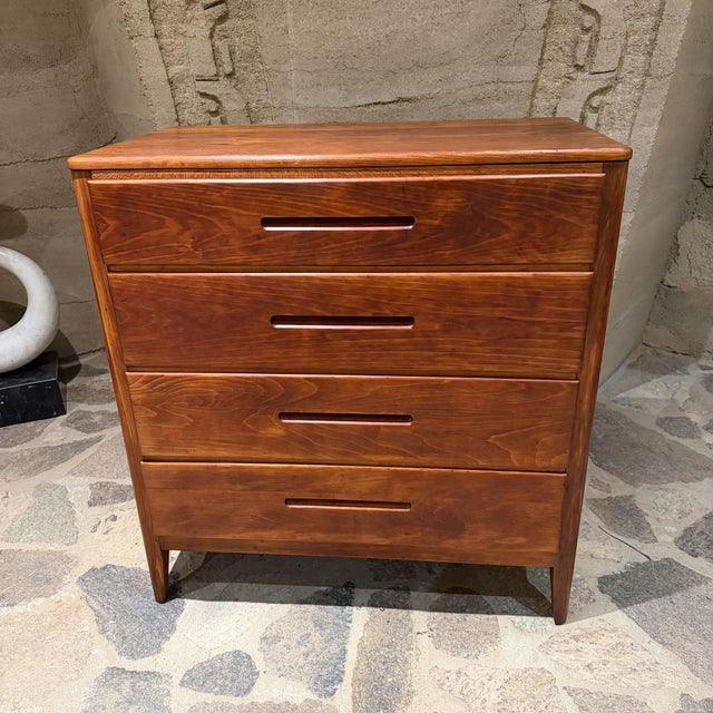 For your consideration, mid-century modern walnut dresser. It is characterized by its sculpted, recessed wooden "sailing...