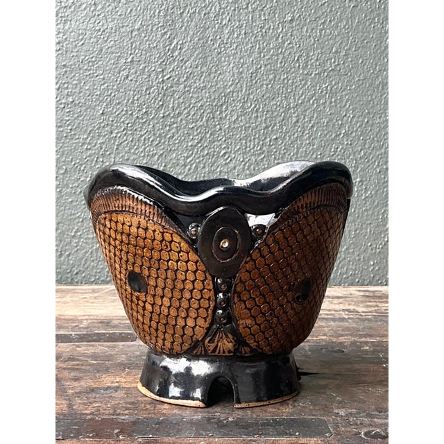 This exceptional studio pottery vase is a striking study in texture and high-contrast modernism. Hand-built with a bold,...