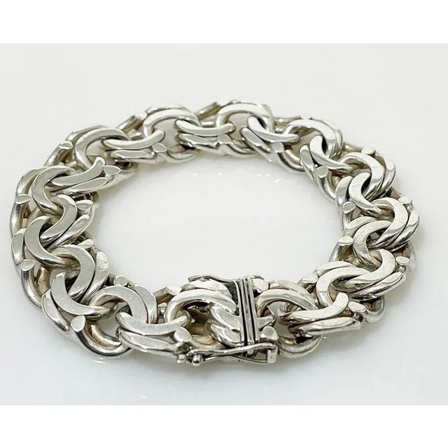 Dutch silver bracelet with a Prince of Wales link A Dutch silver bracelet with a double link chain. The silver links are...