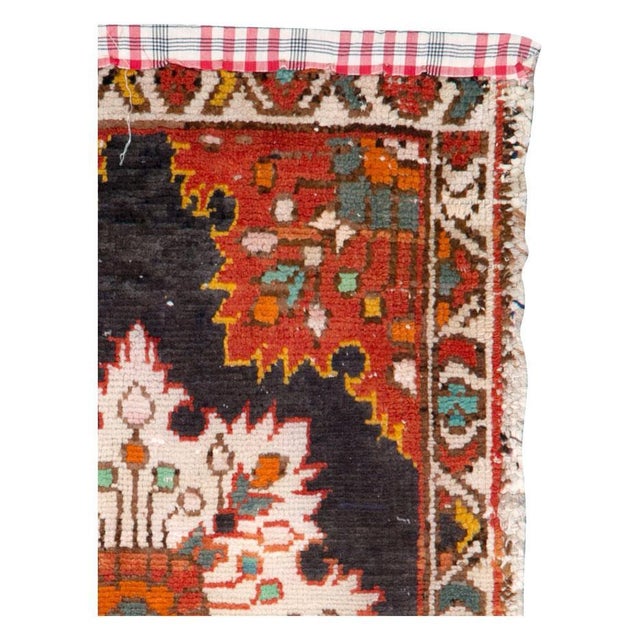 A vintage Persian Hamadan throw rug handmade during the mid-20th century. Measures: 1' 9" x 3' 0" Persian rugs & carpets:...