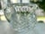 Heavy lead crystal pitcher featuring a basket weave diamond cut pattern around the pitcher and vertical cut lines above...