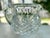 Heavy lead crystal pitcher featuring a basket weave diamond cut pattern around the pitcher and vertical cut lines above...