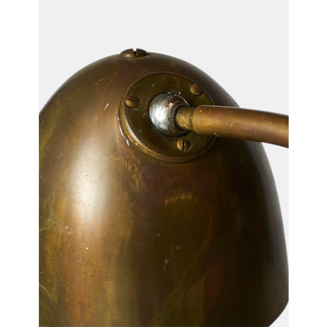 Description Brass Desk Lamp by Vilhelm Lauritzen Denmark, c1940s A table lamp of patinated brass, with adjustable and...