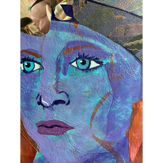 Mixed Media collage featuring the intense gaze of the red-headed model. She's wearing a cloche hat with a flower on it,...