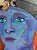 Mixed Media collage featuring the intense gaze of the red-headed model. She's wearing a cloche hat with a flower on it,...