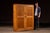 Tall two-door machine tooling cabinet constructed in birch with a straightforward, shop-built presence. The case opens to...