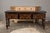 An English oak sideboard from the 19th century with geometric front and turned baluster legs. Enthrall your living space...