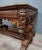 A renaissance-style carved oak dining or center table, dating from the late 19th century. this elegant table is...