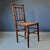 This wooden faux bamboo chair originates from France and is from around 1900.
