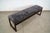 Long Post Modern upholstered bench for sale. It has a solid walnut sled base, and is incredibly well made. It has a darker...
