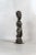 Hand-carved from indigenous wood, this figure comes from the Baule people of the Ivory Coast. Deeply rooted in Baule...