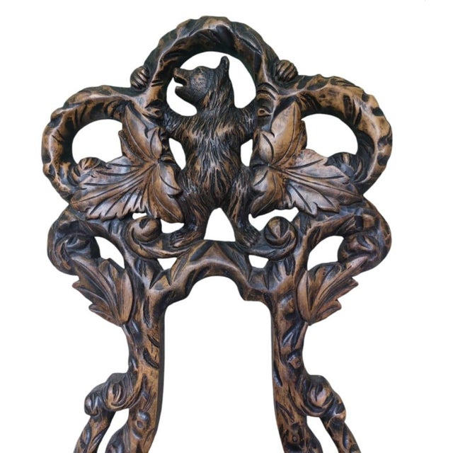 This wonderful decorative and totally functional stander with a carving Bear with open Arms on a refiniture of a floreal...