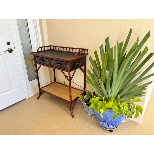 Refurbished Palecek burnt rattan dry bar or entry table. Perfect size for barware or display, with 2 drawers and a lower...