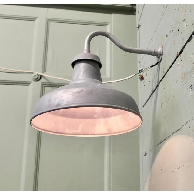 A Large Grey Metal Industrial Wall Light This Industrial wall light hangs on a slender swan neck bracket The wiring is all...