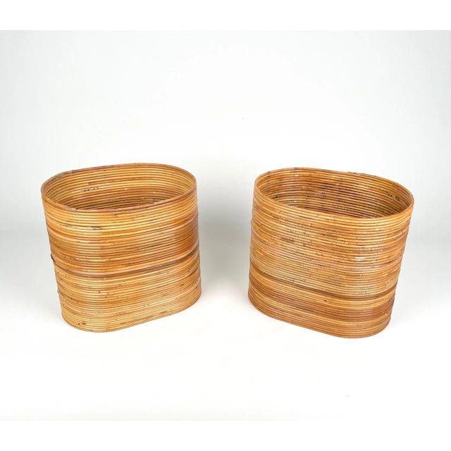 Pair of oval basket plant holder vase in bamboo and rattan made in Italy in the 1960s. An astonishing piece that will...
