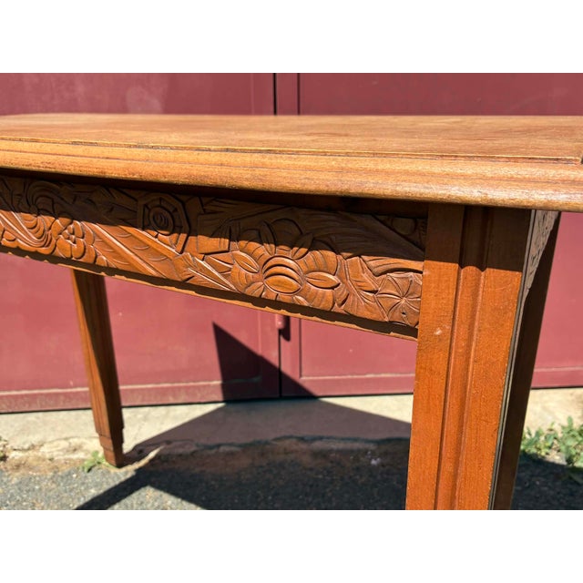 Beautiful Art Deco style side table in beechwood. Features lovely carved details on the edges of the table. A small,...