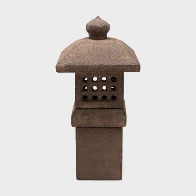 Sculptural lanterns of carved stone or wood are traditionally placed throughout Buddhist temple grounds or courtyard...