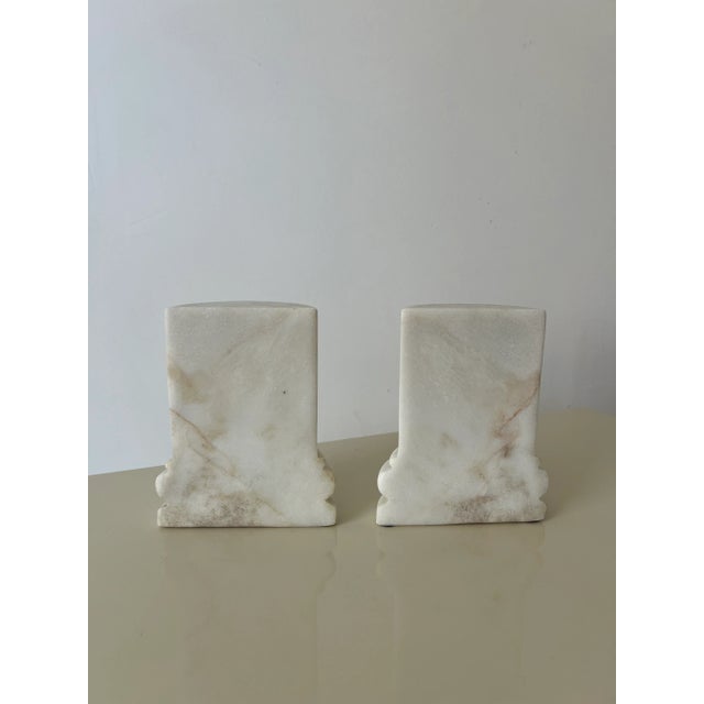Gorgeous vintage marble bookends resembling pillars or column. Hand carved from a block of Italian marble each have unique...