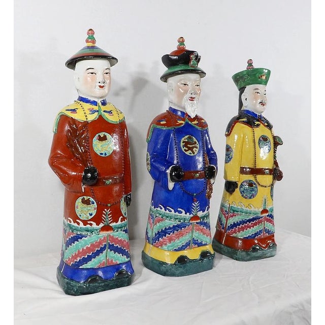 Set of three major statues in Chinese polychrome earthenware, representing Chinese ancestors in motionless posture in a...