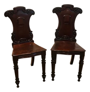 Pair of Hand Carved Mahogany Armorial Hall Chairs