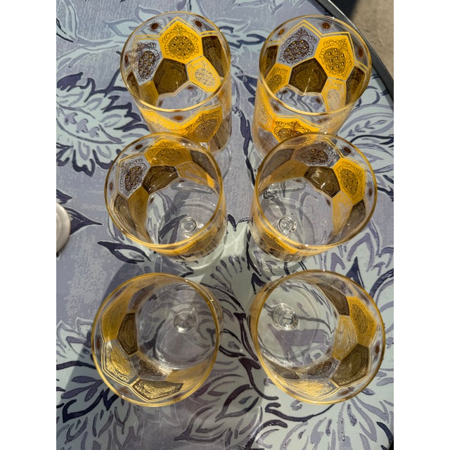 Cera Ned Harris Pineapple motif stemmed, highball, made of clear glass with 22k gold and yellow geometric pineapple...