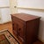 A late 19th century American dry sink cabinet, executed in warm-toned wood, possibly cherry but more likely stained...