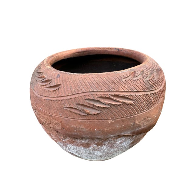 Vintage mid 20th century terracotta clay planter. Handsomely aged patina with whiting and the outermost (slip layer)...