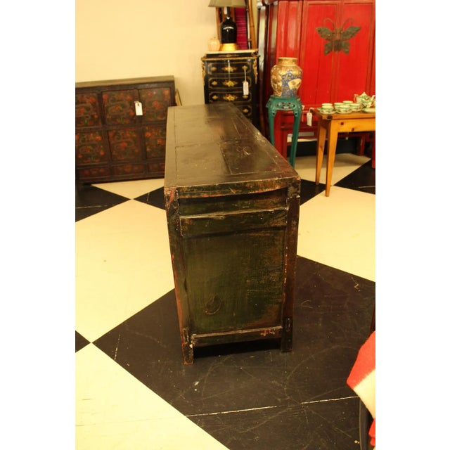 This traditional Tibetan low cabinet is completely hand-painted. The front side of the cabinet is in red lacquer with...