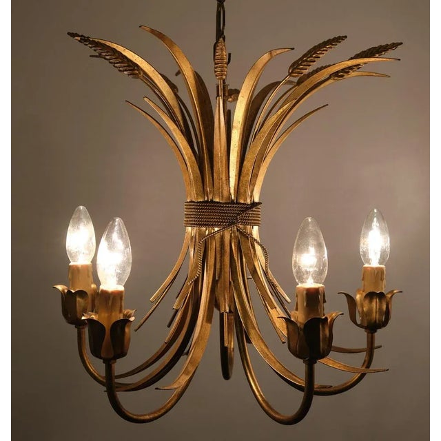 Beautiful pair of Gilded Brass Wheat Sheaf chandeliers . 5 arms signed . So stylish . Italy 1970s . good condition. small...