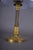Table lamp made from a 19th-century ormolu gilt bronze candlestick, with a fluted column and ornate circular base. The...