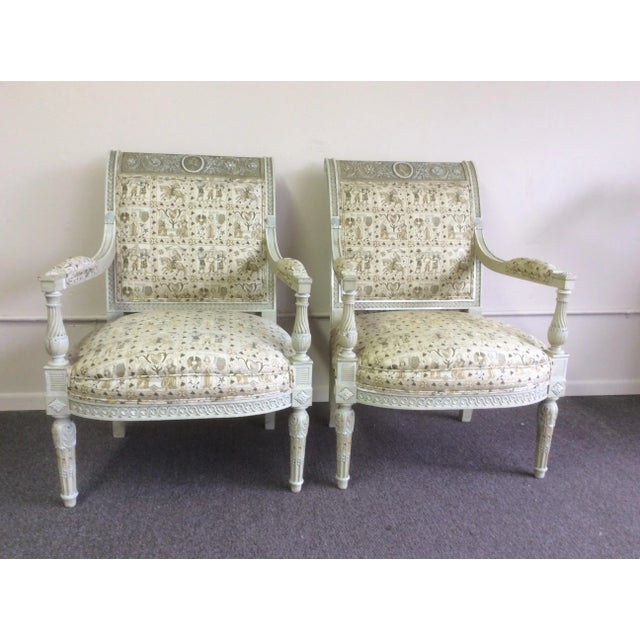 Beautiful antique carved European Arm Chairs With a his and her portrait bust carved in a Medallion. These have layers of...