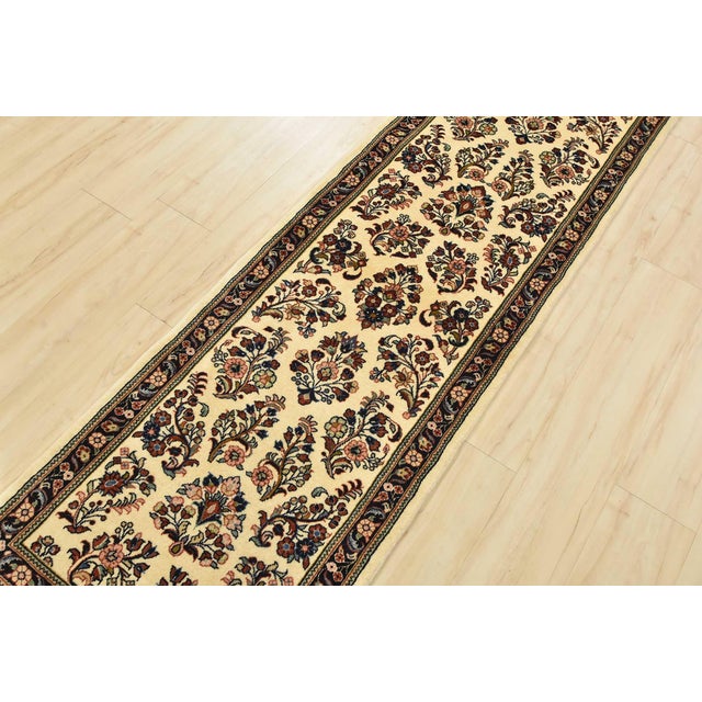 An authentic vintage traditional Kashmar runner hand-knotted with fine wool and natural dyes. This intricately woven...
