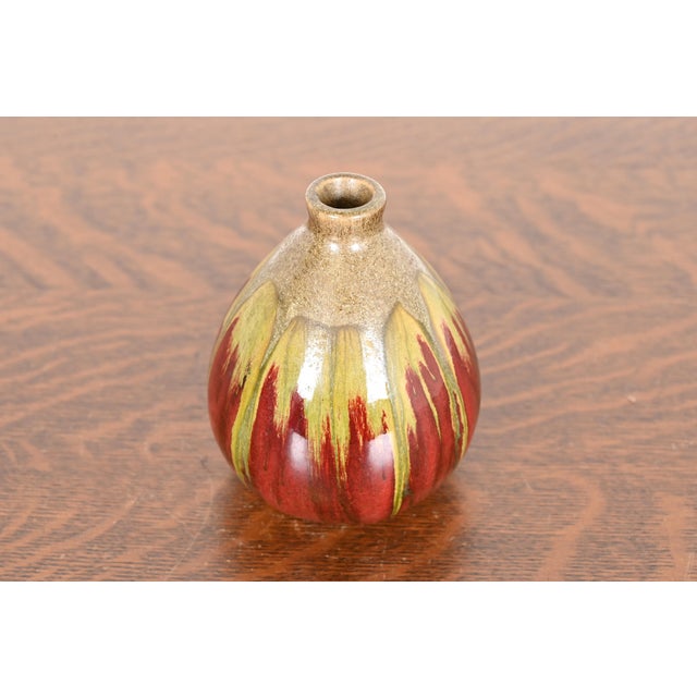 A gorgeous Modern drip glazed ceramic art pottery vase In the style of Rookwood Pottery Circa Late 20th Century Glazed...